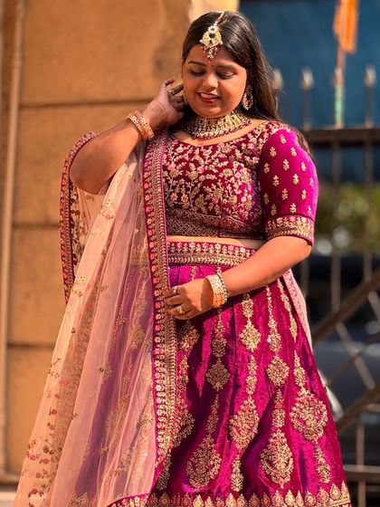 A close-up look at the beautiful craftsmanship on this purple bridal lehenga. The velvet fabric and detailed work make it look and feel so luxurious.