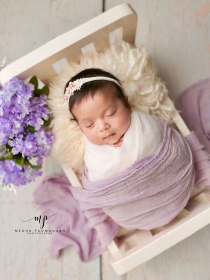 A wider view of the lavender-themed bed setup.