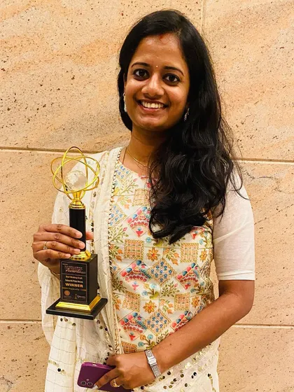 A proud moment for me, holding my award for 'Best Wedding Craft' from the Kovai Business Awards 2022. This recognition is a testament to my decade of passion and the support of my wonderful clients.