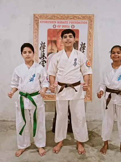 Three of my senior students after their successful belt upgrade. Their new belts are a symbol of their progress and dedication.