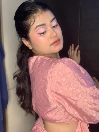Another angle of the playful pink graphic liner look.