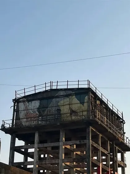 A mural painted on an old, elevated water tank at Sassoon Dock. This shows how artists use unconventional and challenging surfaces as their canvas during art festivals.
