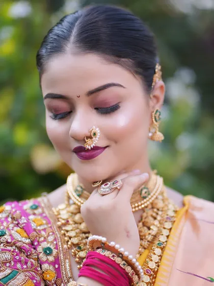 A close up showcasing the soft, shimmery eyeshadow and flawless skin. This look proves that traditional Maharashtrian makeup can also be soft and romantic.