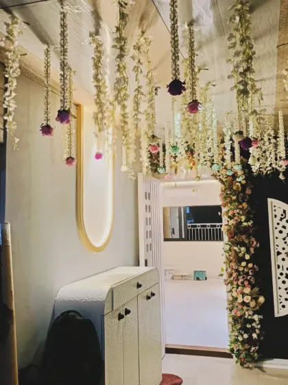 A simple way to decorate a home entrance. I used strings of jasmine and rose flowers hanging from the ceiling to welcome guests into the celebration.