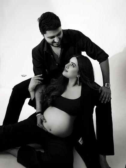 A playful and loving moment captured in black and white. The way they are looking at each other is just the cutest.