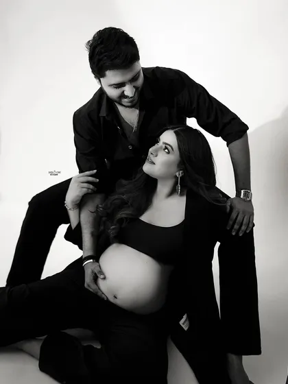 A playful and loving moment captured in black and white. The way they are looking at each other is just the cutest.