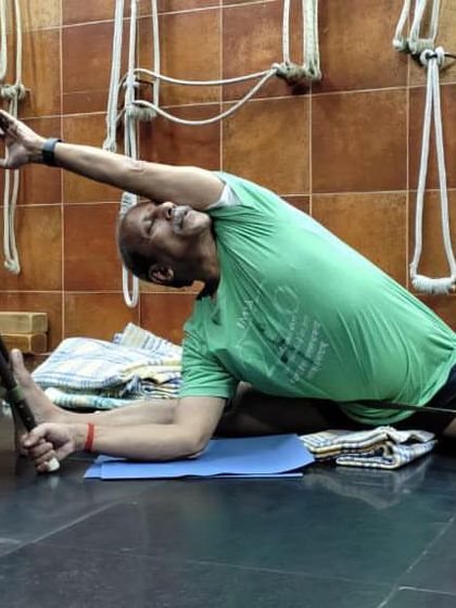 A seated forward bend with a chair.