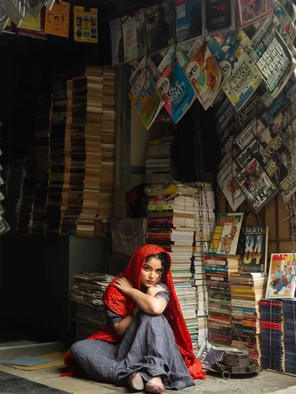 A wide shot from the editorial, where the model's simple makeup and styling stand out in a cluttered, atmospheric setting. This shows how makeup can help tell a story.