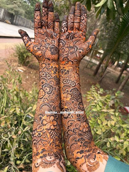 The beauty of a full coverage design is how it flows seamlessly from the palm to the arm. This piece is packed with paisleys, flowers, and checkerboard fills.