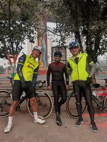 Three of our riders posing with their bikes mid-ride. The camaraderie is as important as the cycling itself.