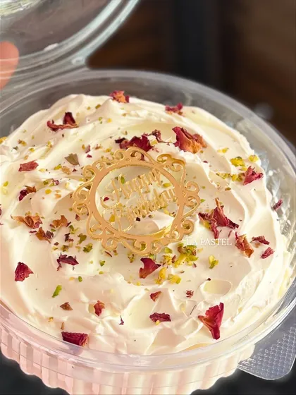 A detailed shot of the Rose Tres Leches tub, featuring a custom "Happy Birthday" acrylic topper.