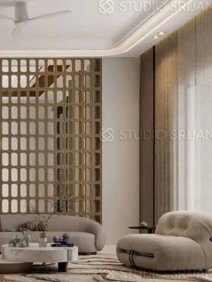 This image showcases a decorative jaali screen used as a room divider, adding a traditional touch to a contemporary space while allowing light to filter through.