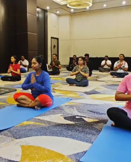 Our staff in a moment of quiet meditation during the yoga session. We believe that well-being starts from within and are happy to facilitate that journey.