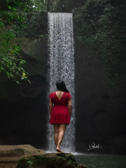 An artistic, contemplative shot facing Tibumana Waterfall. Sometimes, a photo looking away from the camera can tell a more powerful story about the experience of being in a place.