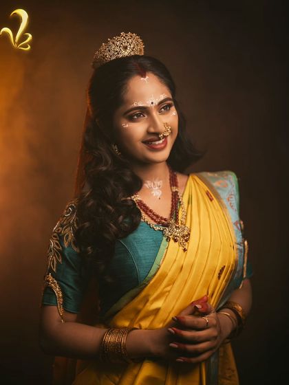 Another look at the Chandrakantha styling, this time with softer lighting. The combination of the teal blouse, yellow saree, and traditional jewellery creates a look that feels both divine and approachable, reflecting the dual nature of a modern bride.