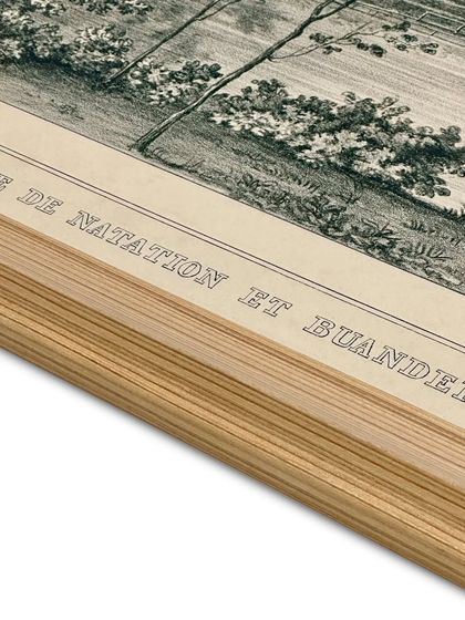 A close-up detail of a framed etching print. You can see the texture of the Canson archival rag paper and the clean lines of the solid wooden frame. Proper dry mounting is crucial, especially in humid climates, to prevent warping.