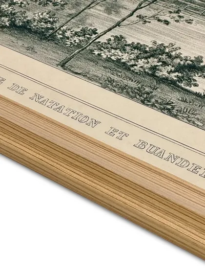 A close-up detail of a framed etching print. You can see the texture of the Canson archival rag paper and the clean lines of the solid wooden frame. Proper dry mounting is crucial, especially in humid climates, to prevent warping.