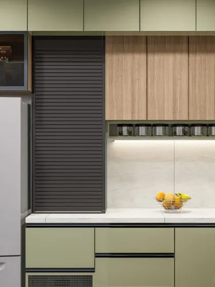 We specialize in smart storage solutions for a clutter-free kitchen. This design incorporates a rolling shutter cabinet, also known as an appliance garage, to neatly conceal countertop appliances like a toaster or coffee maker when not in use, maintaining a clean and organized look.