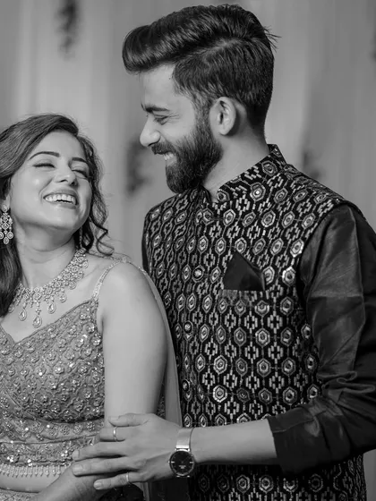 A beautiful black and white shot of Manali and her partner, her smile and happiness shining through.