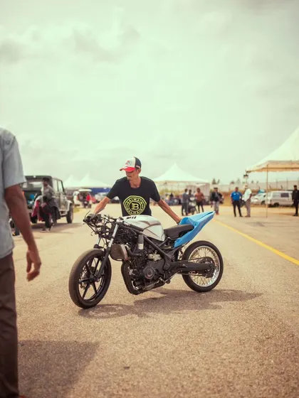 A participant with his custom-built drag bike, a machine that's as much about style as it is about speed.