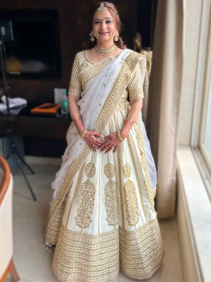 A full portrait showcasing the graceful and sophisticated look we created for this beautiful mother of the bride.