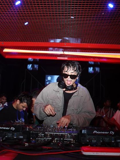 Performing at Sunburn Union in Bangalore. The red cage-like DJ booth adds to the unique, industrial vibe of the party.