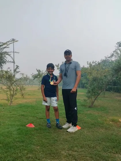 Posing with a proud student and his medal after a successful competition. My youth sports coaching is designed to build both skill and confidence.