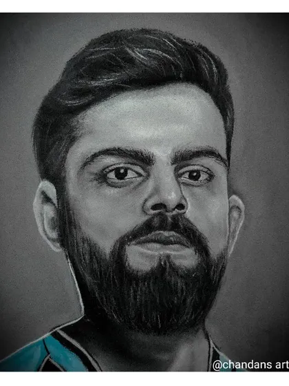 This portrait of King Kohli showcases the striking contrast that can be achieved with charcoal and white stone powder on a neutral background. It's a powerful medium for creating memorable portraits.