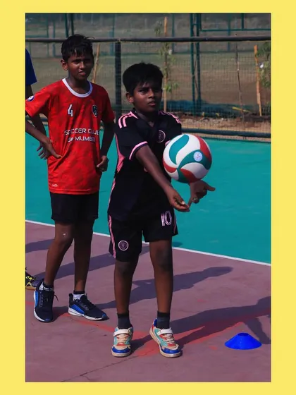 A young player receives the ball, demonstrating the "bump" technique we instill in all our beginners. It all starts here.