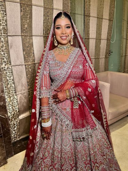 Kicking off the 2024 season with this stunning bride. I created a look with soft, shimmery eyes and a flawless base to complement her intricate silver and red lehenga.