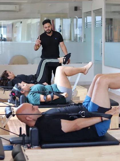 I believe in quality over quantity, which is why my classes have a maximum of five people. This image captures a typical small group session, where I can provide personalized guidance and hands-on adjustments to ensure everyone is moving safely and effectively.