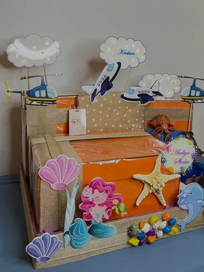 A full frontal view of the spectacular hamper, showing how the two distinct themes for the twins come together in one cohesive and magical presentation.
