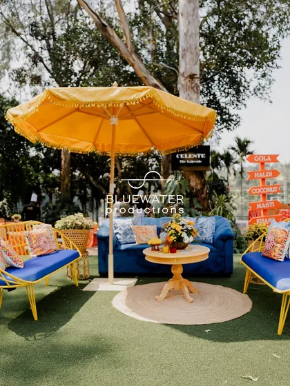 A Haldi should be full of life and laughter. For this 'Dolce Vita' themed event, we created vibrant lounge areas with pops of blue and yellow, complete with custom cushions and shady umbrellas for a relaxed, joyful vibe.