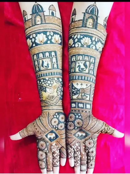 A classic Rajasthani theme with palace architecture at the top. The design includes swans, lotus flowers, and auspicious symbols like the swastika.