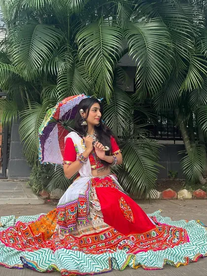 Adding a colorful umbrella to the look! This accessory is perfect for photos and adds an extra touch of festive fun.