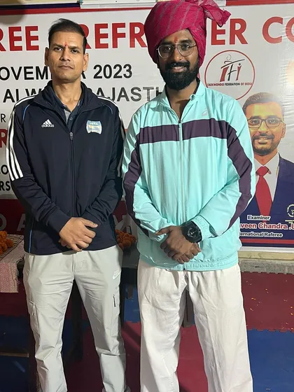 Pictured with an official at the National Referee Course in Alwar, Rajasthan. Collaboration with regional associations is key to promoting Taekwondo.