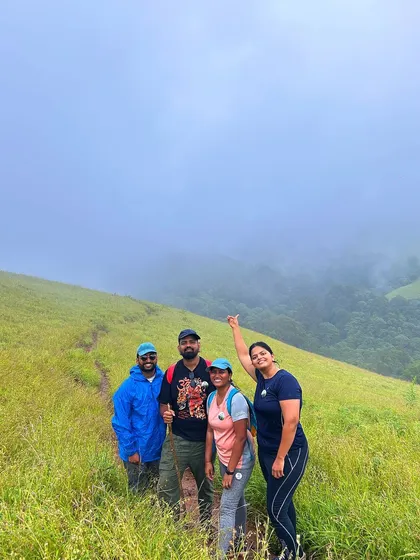 A group of friends in the misty meadows of the Bandaje trek.
