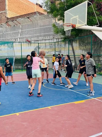 A female player takes a shot in the paint.