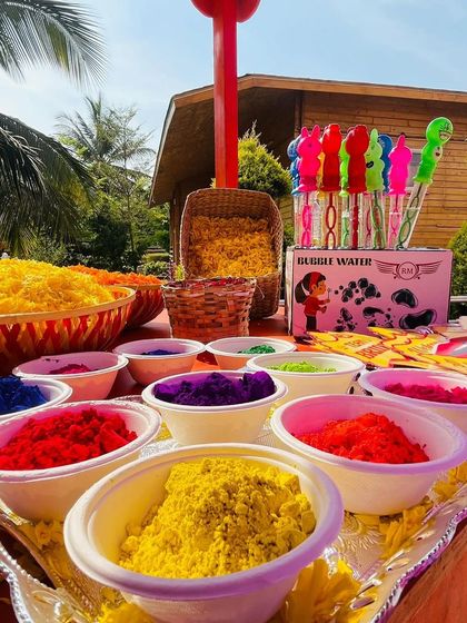 A colorful station with organic colors and bubble wands, adding a playful and festive touch to the Haldi celebrations.