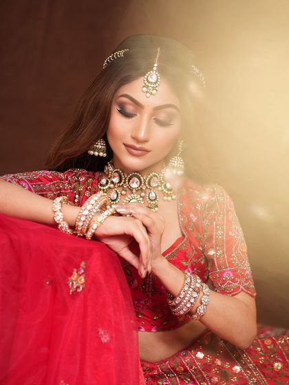 A beautiful portrait from the photoshoot, the soft lighting creating a dreamy effect on her glamorous makeup.