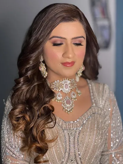 A close-up of Ural's makeup. The soft waves and glowing skin create a look that is perfect for a reception or engagement party.