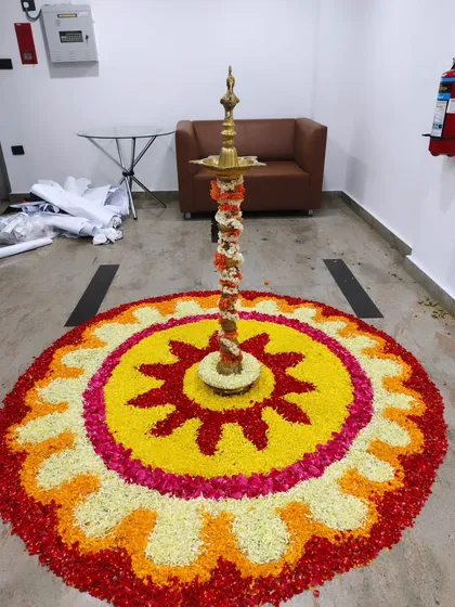 I blend tradition with modern corporate style. This intricate flower petal rangoli with a traditional brass lamp (Diya) at its center brought an auspicious and beautiful touch to the Trans cosmos office opening.