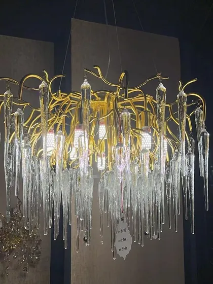 An artistic chandelier with icicle-like glass elements. This fixture creates a stunning visual, especially suited for modern and minimalist interiors that need a touch of drama.