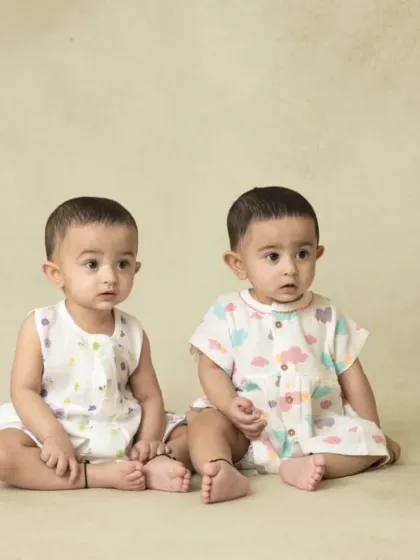 A collection of simple, classic portraits of twin babies. Without props or themes, their individual expressions and connection are beautifully highlighted.