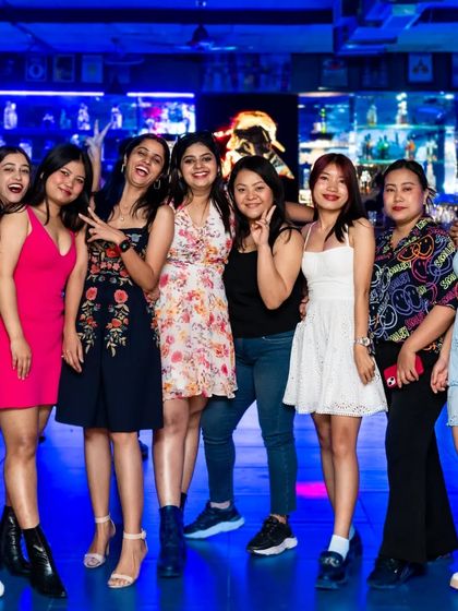 A large group of ladies ready to party.