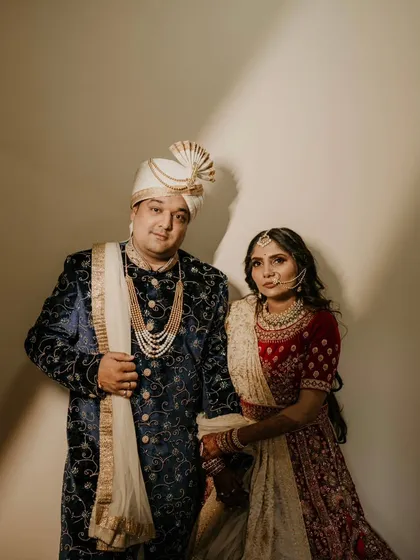 A royal portrait with a medieval feel. The rich colors of their outfits and the dramatic lighting create a sense of timeless grandeur.