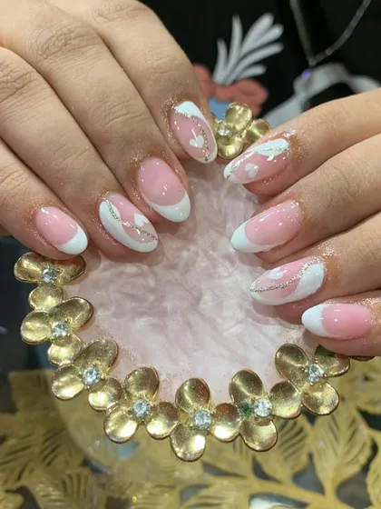 A soft and dreamy design with pink and white abstract shapes, clouds, and a delicate silver glitter line.