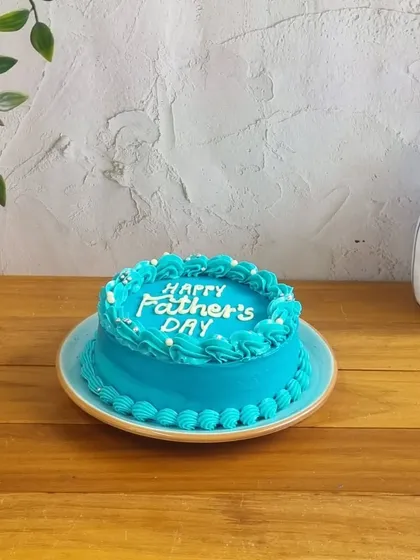 A bright blue "Happy Father's Day" cake that's simple, sweet, and straight to the point.