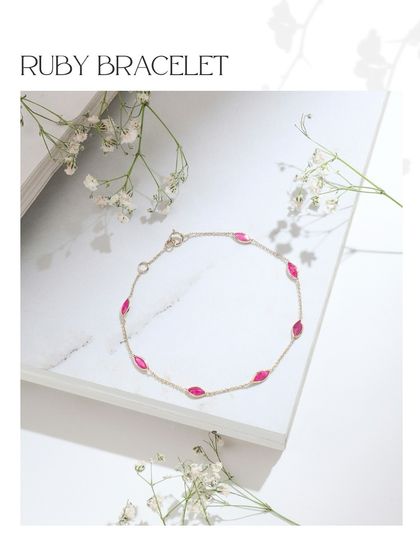 A delicate ruby bracelet, featuring marquise-cut rubies set along a fine gold chain. A perfect touch of color for everyday wear.