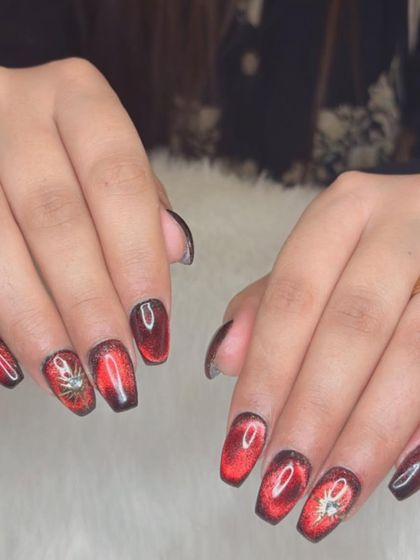Another look at the intense red jelly cat eye nails.